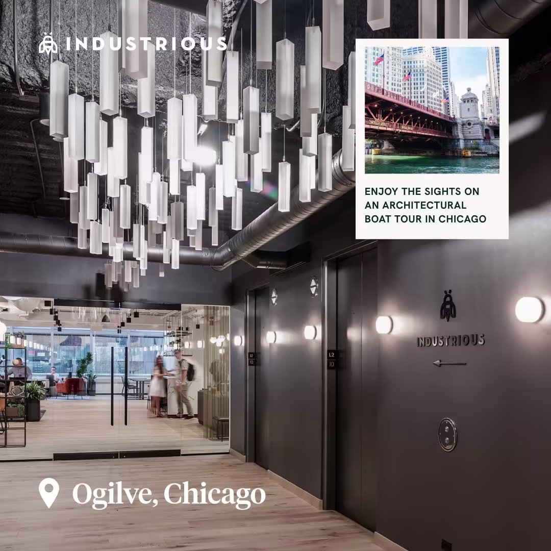 Industrial-style hallway at Industrious Ogilvie in Chicago, with inset photo of a Chicago architectural boat tour.