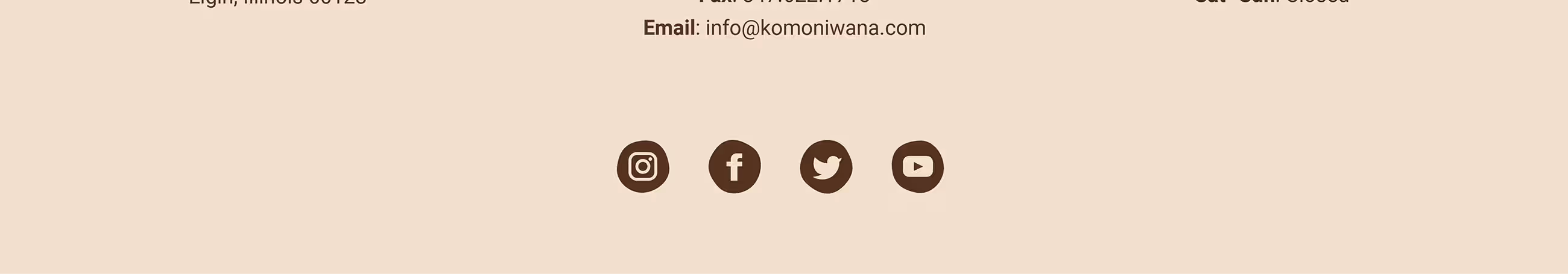 Footer bar displaying Komoniwana email address and social media icons.